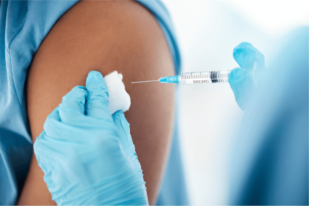 Doctor administering an HPV vaccine to patient