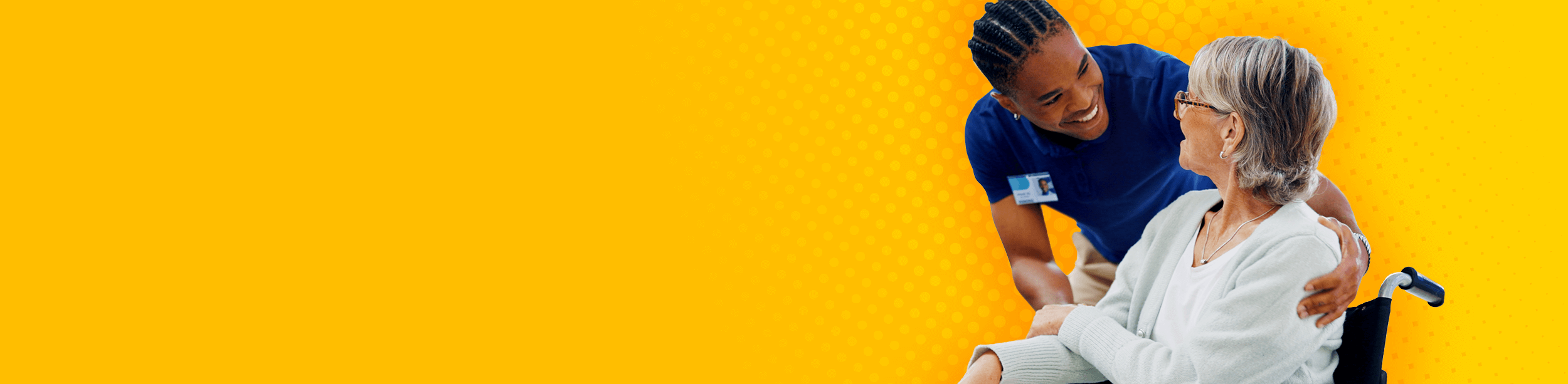 Doctor speaking with a patient in a wheelchair