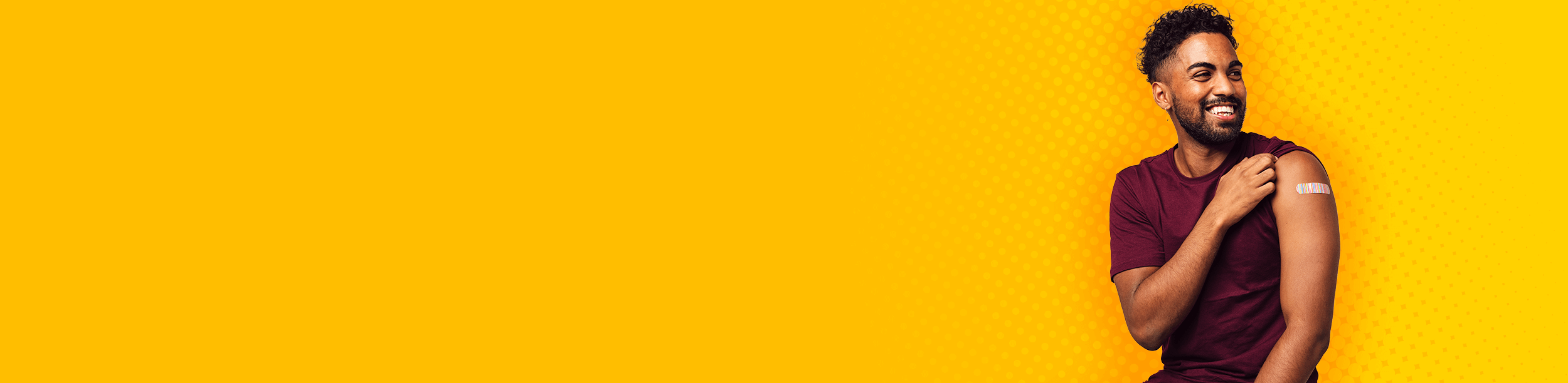 Patient smiling with bandage on arm