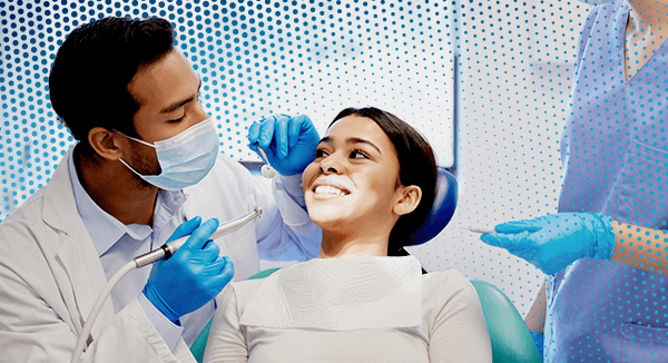 Dentist working on a patient smiling