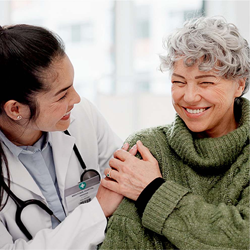 Doctor speaking with a patient and smiling