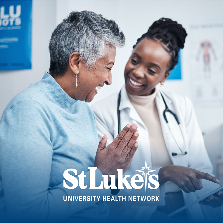 Doctor speaking with patient above St. Luke's logo