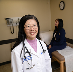 Dr. Lam with a patient